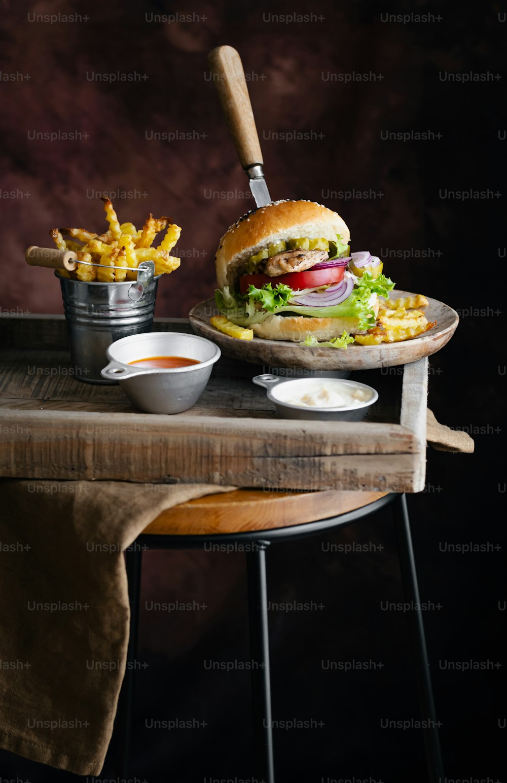 a plate of fries and a sandwich on a table
