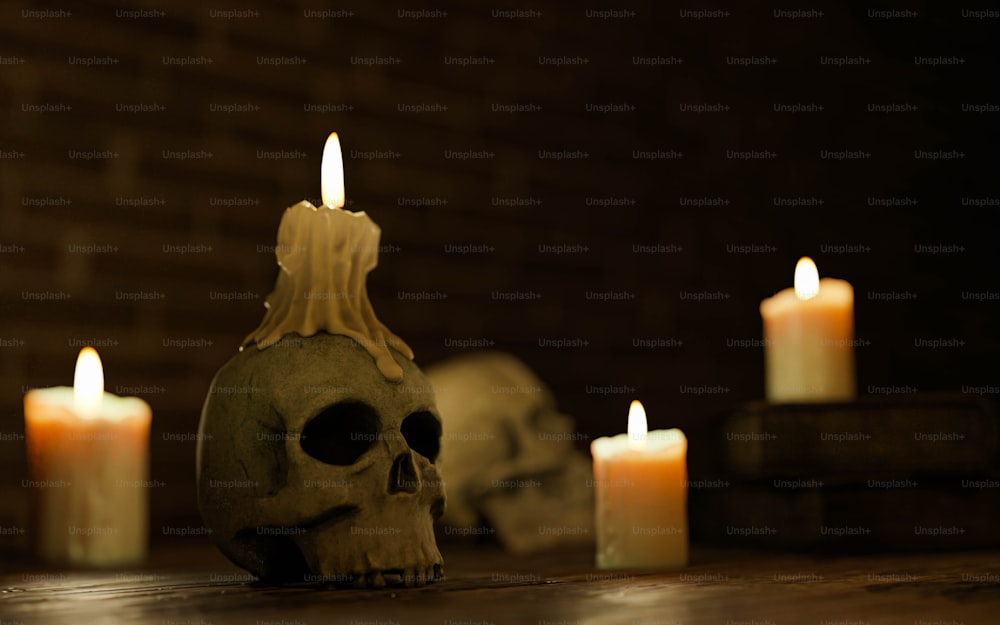 a skull sitting on top of a wooden table next to candles