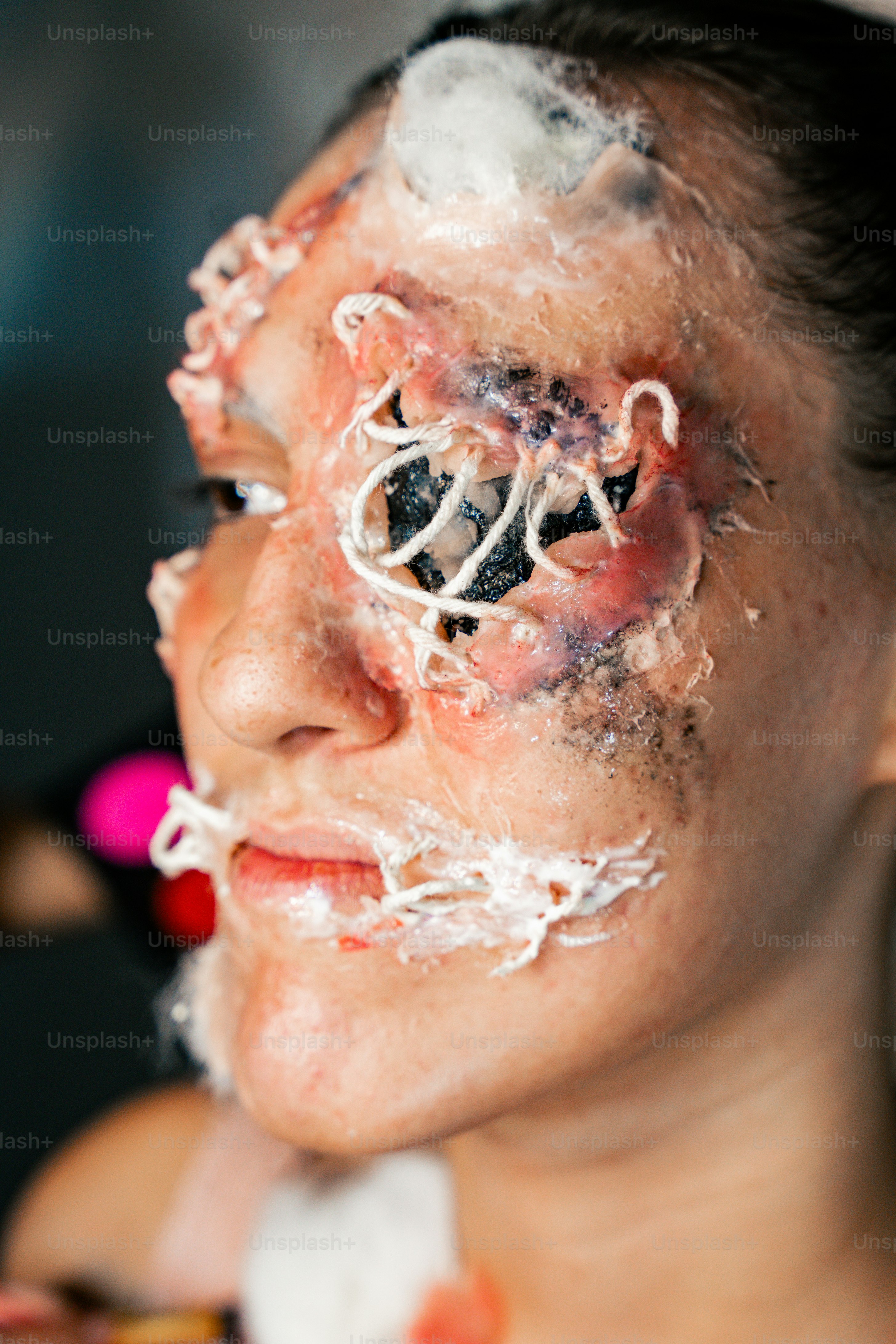 a woman with white hair and a fake face