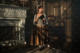 a woman in a dress standing in front of a fireplace
