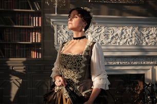 a woman in a renaissance dress standing in front of a fireplace