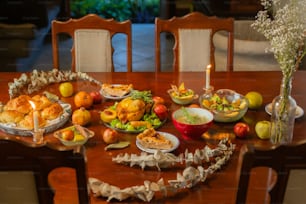 a wooden table topped with lots of food