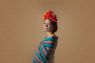a woman in a colorful dress with a skull on her head
