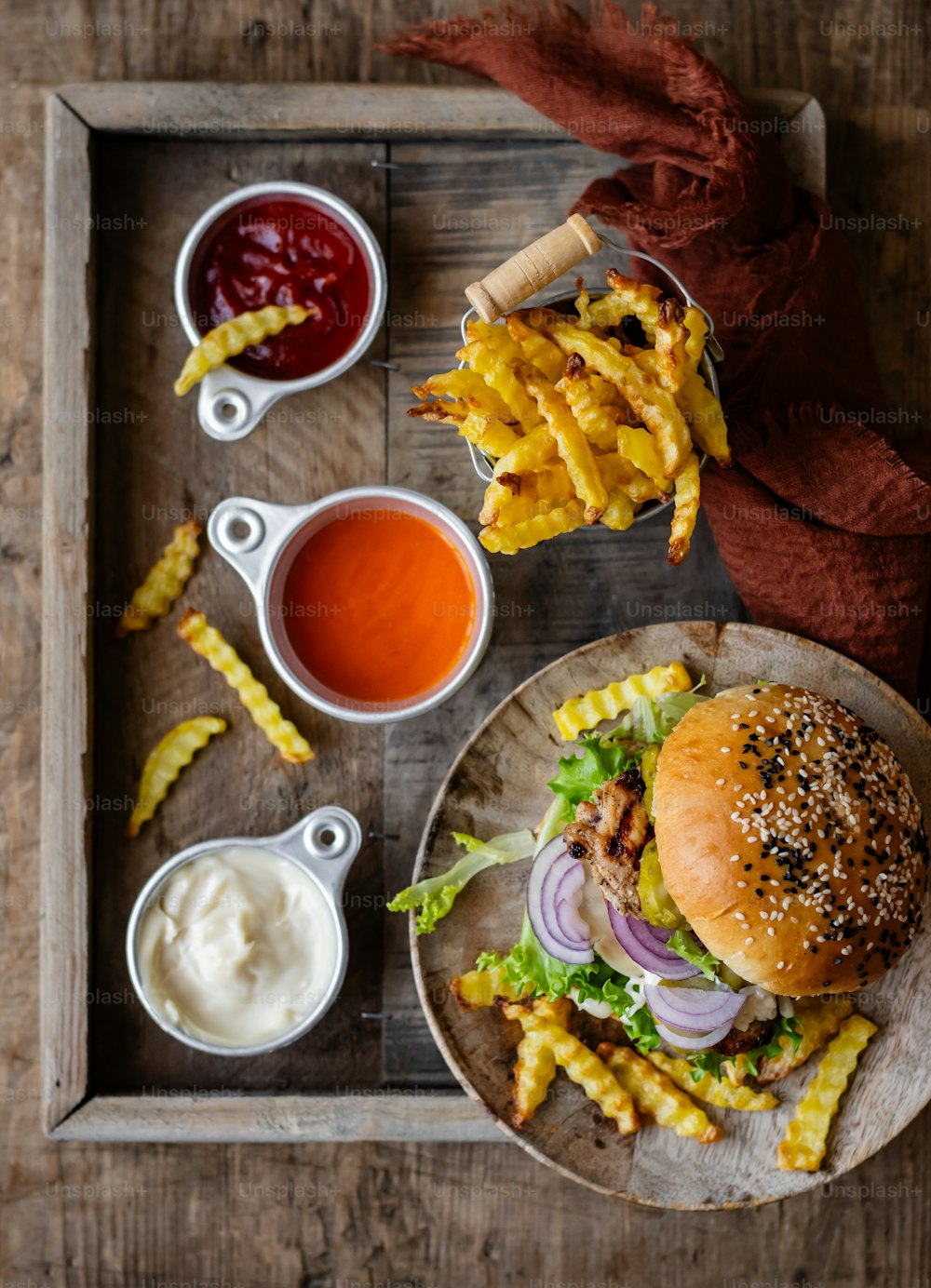 a tray with a burger, fries and ketchup