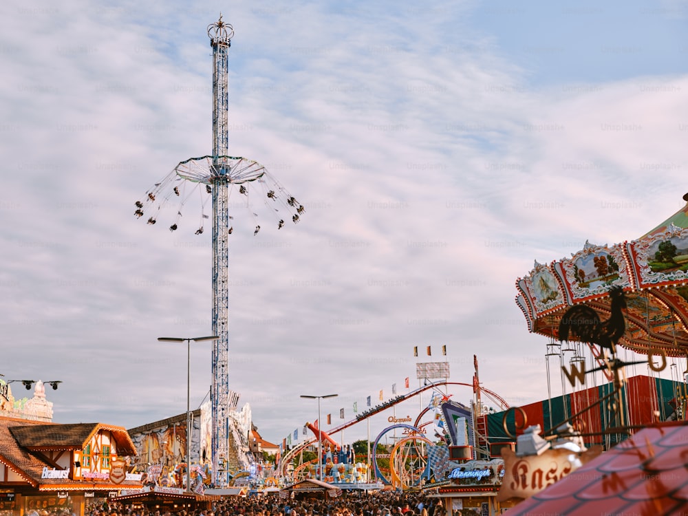an amusement park with a ferris wheel and rides