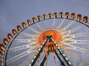 a large ferris wheel on a cloudy day