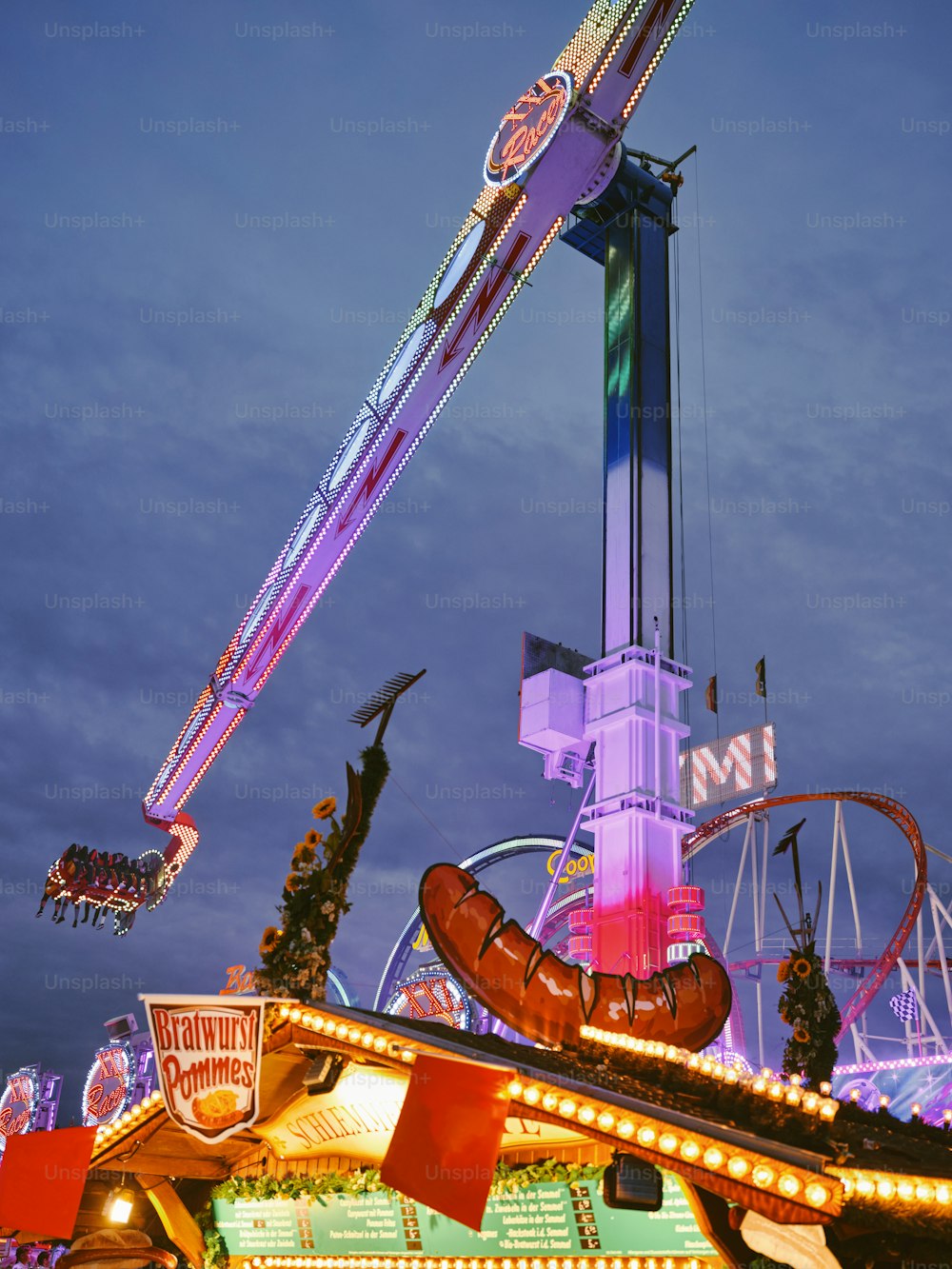 a carnival ride at night with lights on it