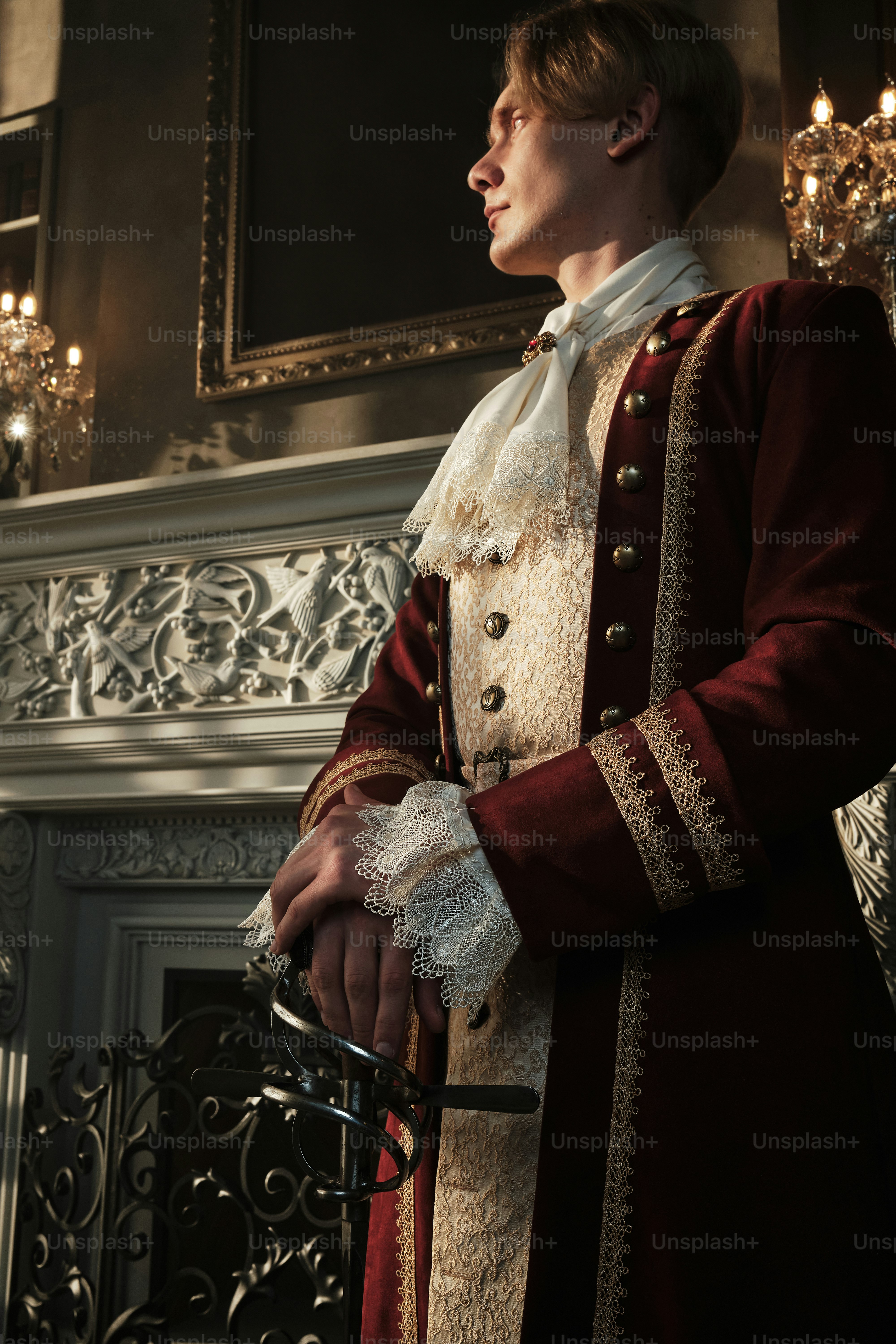 a man in a red and white outfit standing in front of a fireplace