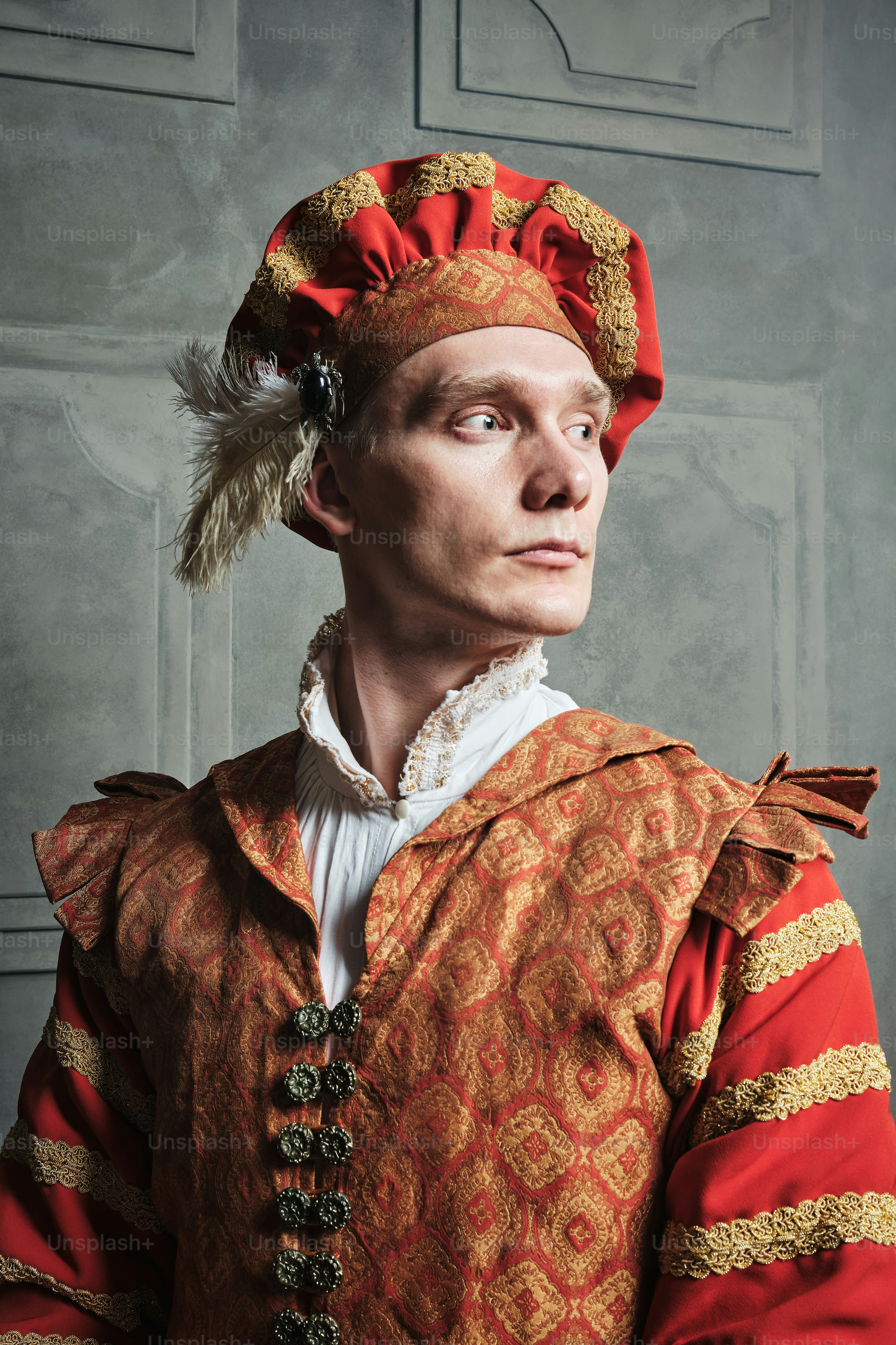 a man in a red and gold costume