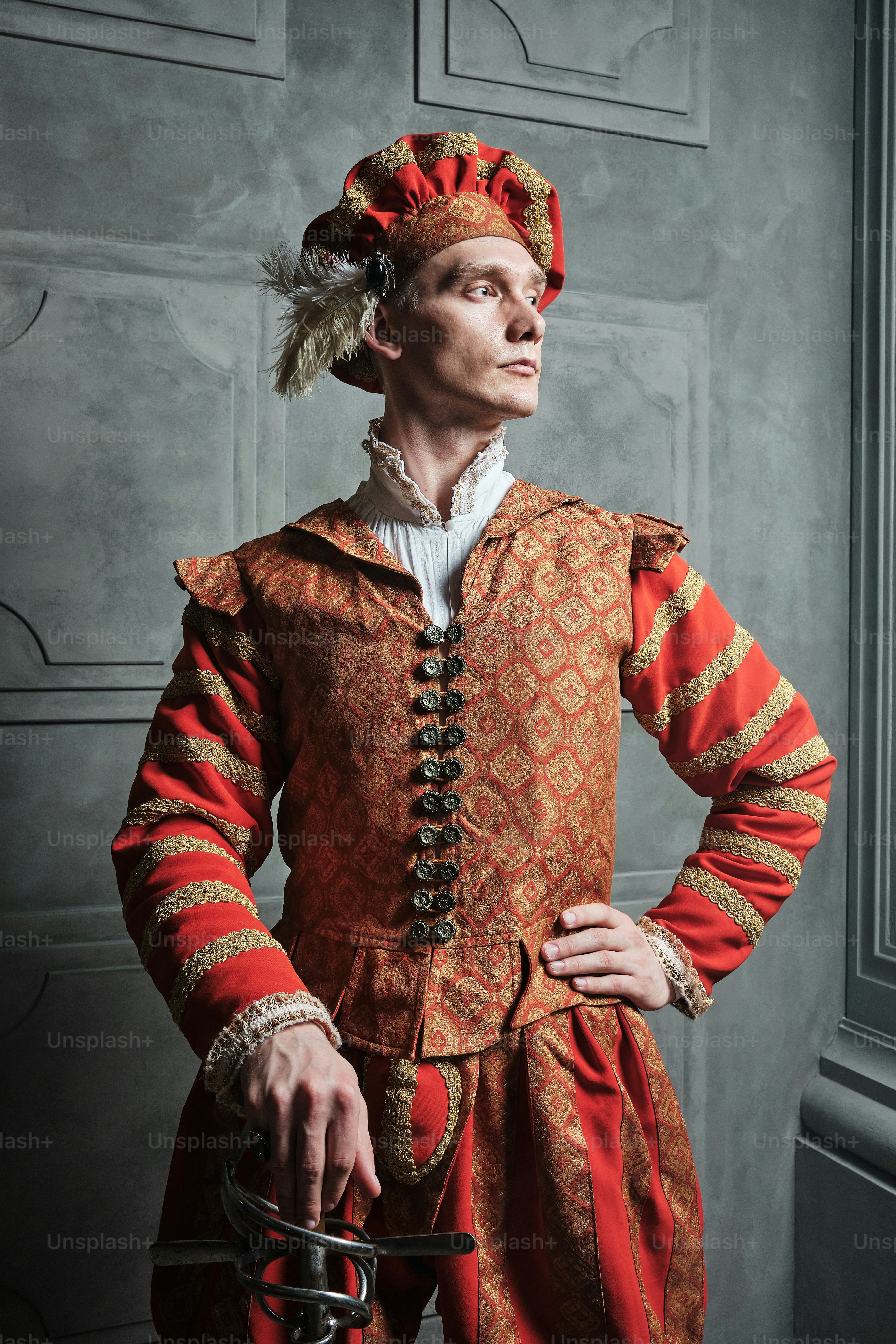 a man in a red and gold costume