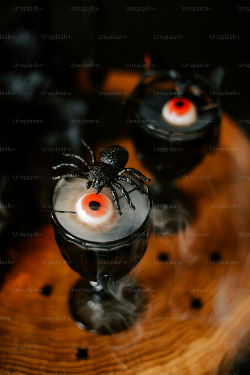 a halloween drink with a spider on top of it