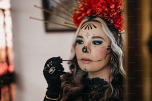 a woman with face paint holding a cigarette