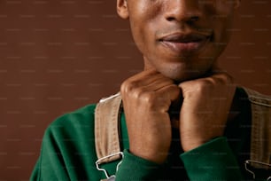 a close up of a person wearing a green sweater