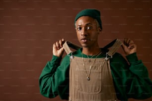 a man wearing a green sweater and a green hat