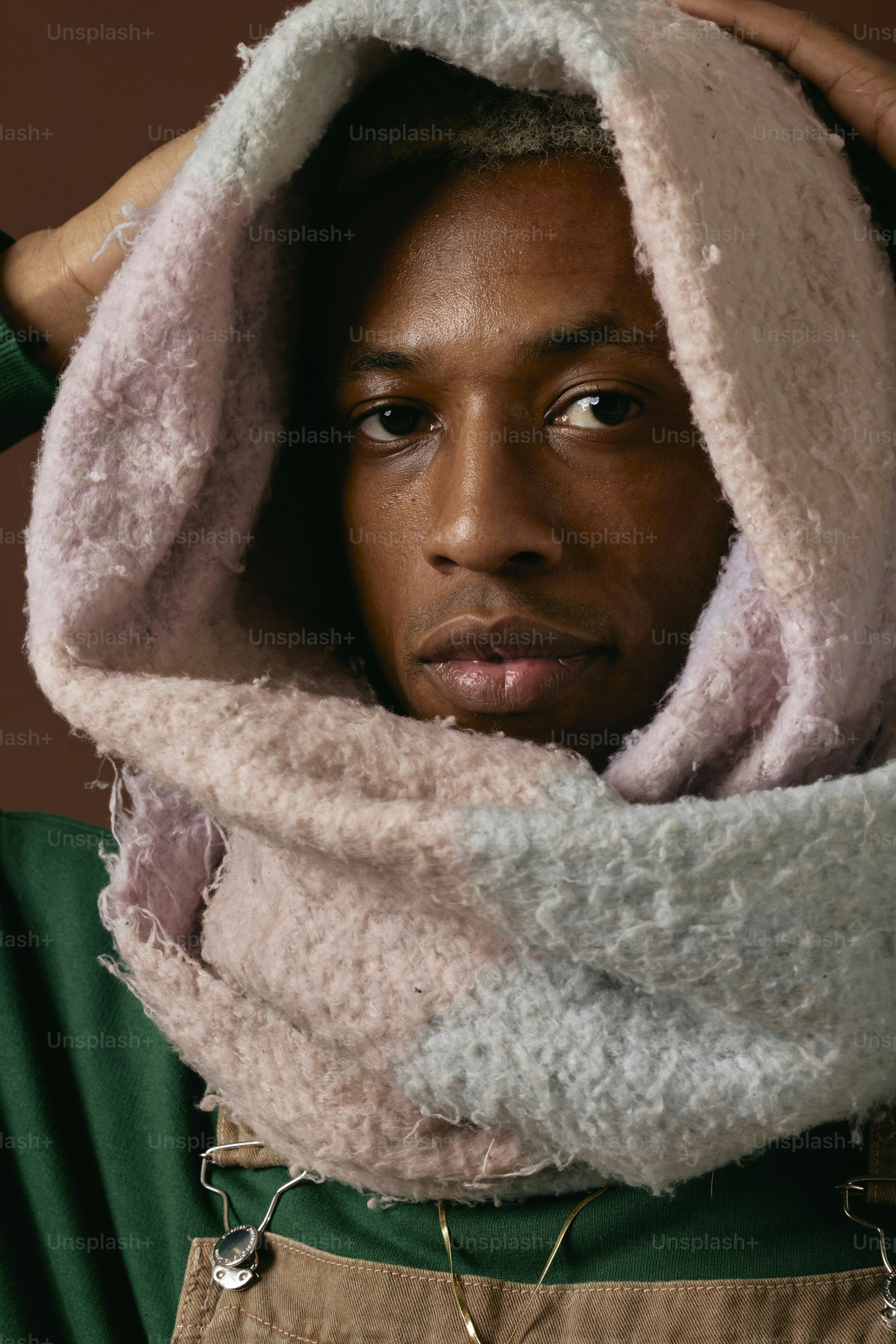 a man with a scarf around his neck