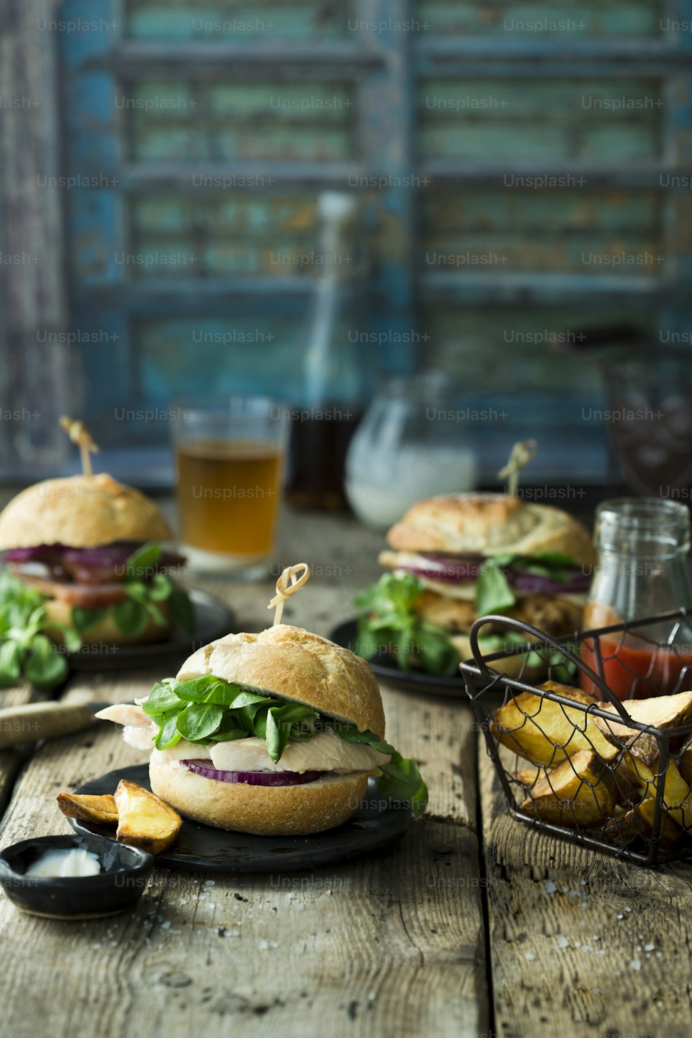 a table topped with two sandwiches and fries