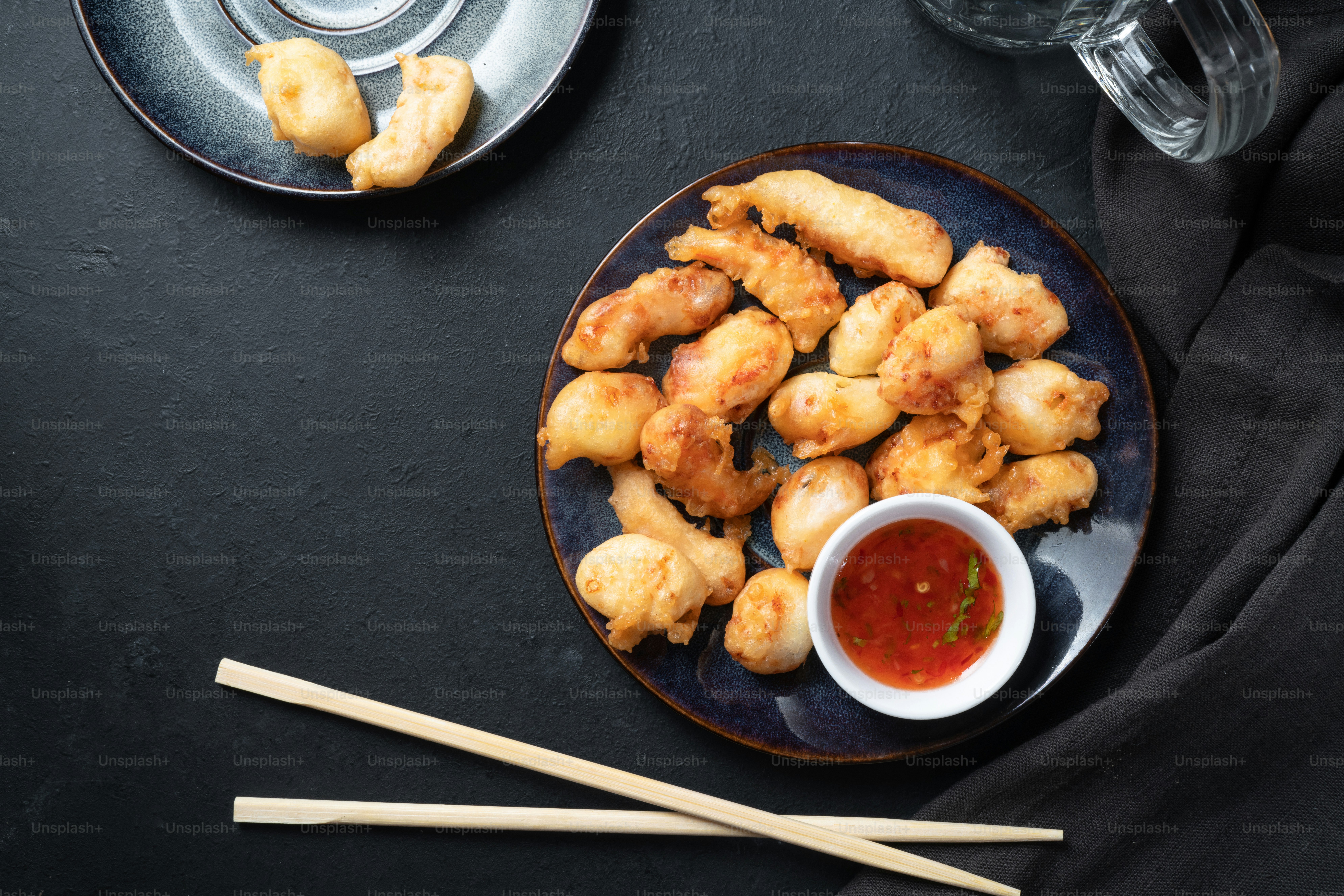 a plate of food on a table with chopsticks