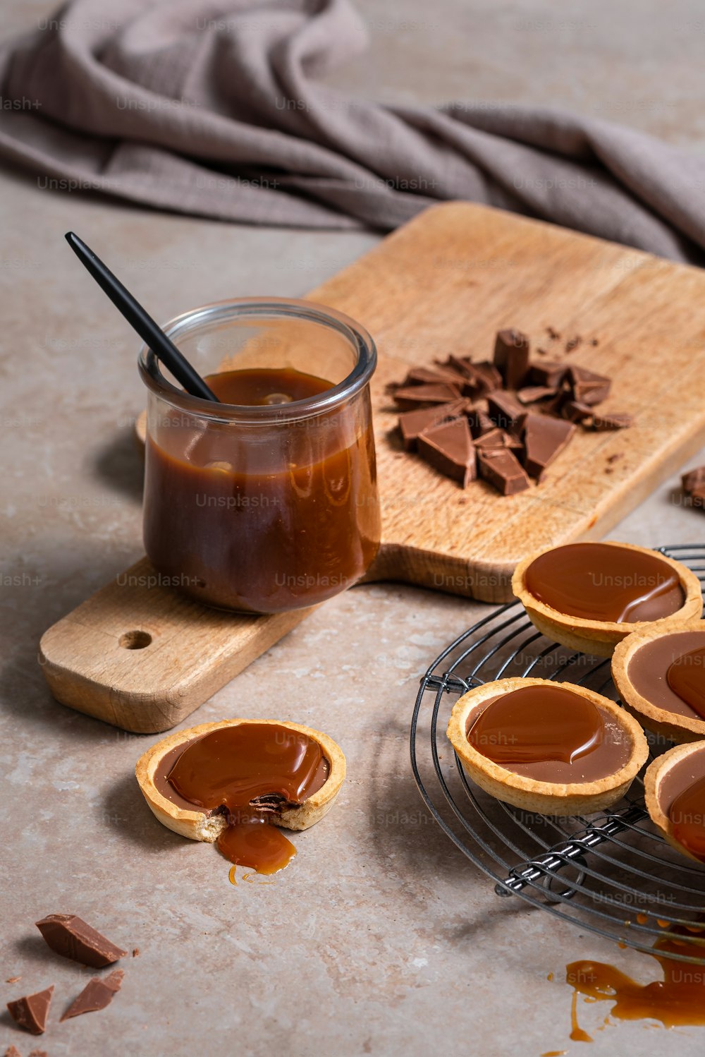 a plate of peanut butter cups and a jar of caramel