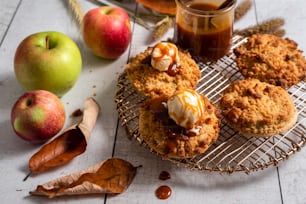 a cooling rack with some cookies and some apples