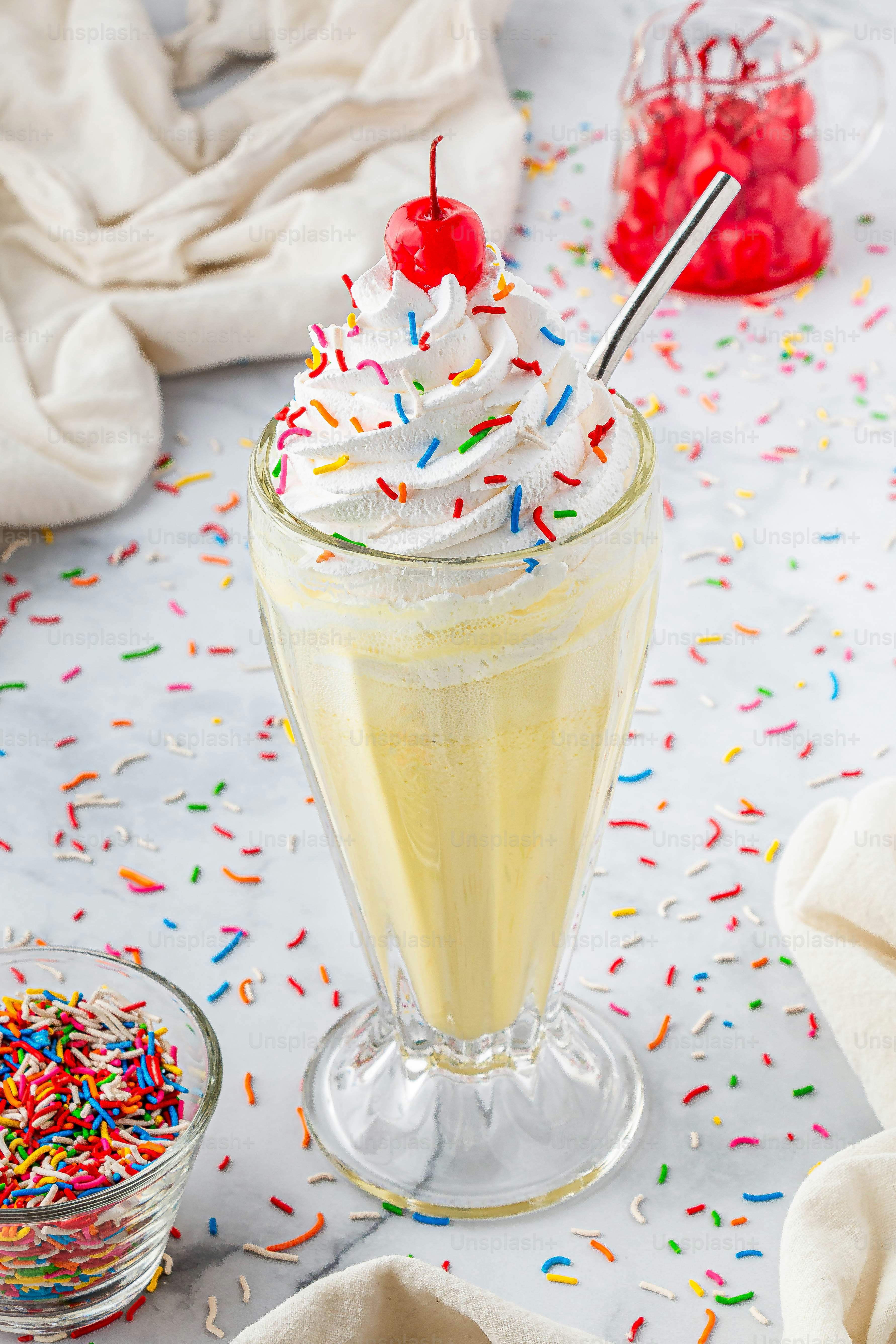 A cup of ice cream with sprinkles and a cherry on top photo – Food Image on  Unsplash, image size:3000x4500