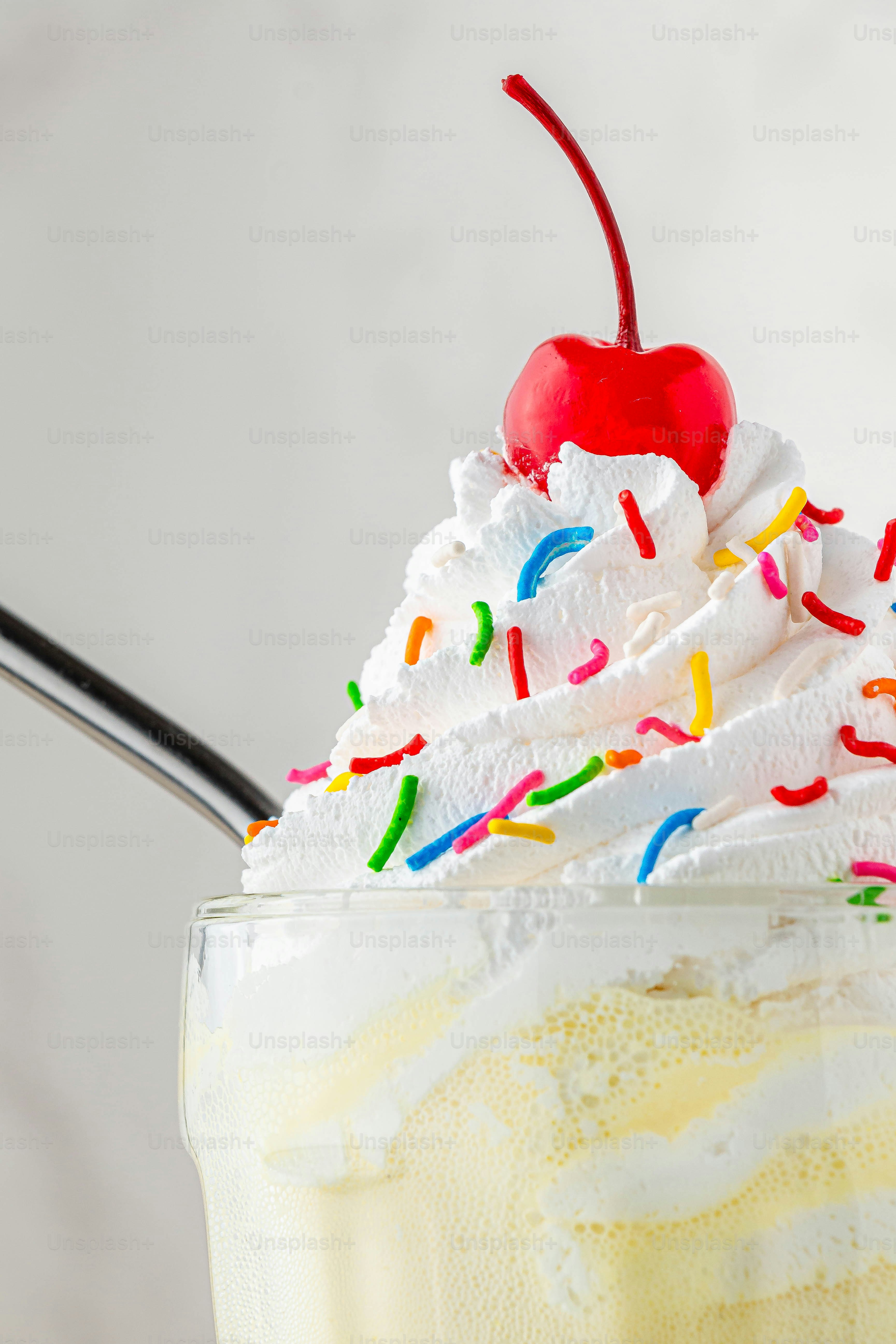 A cup of ice cream with a cherry on top photo – Food Image on Unsplash