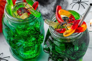 a couple of jars filled with green liquid