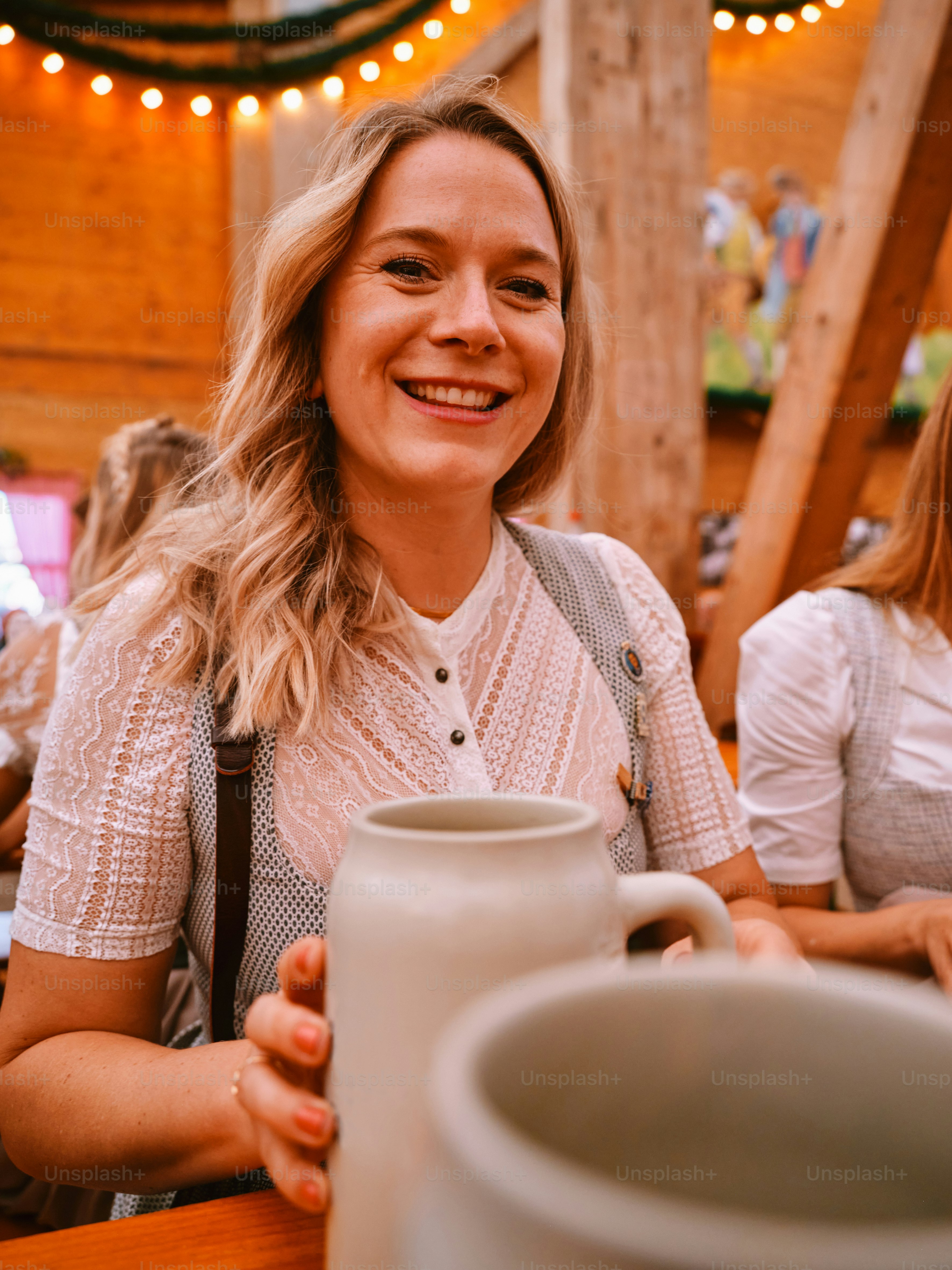 a woman holding a coffee mug in her hands