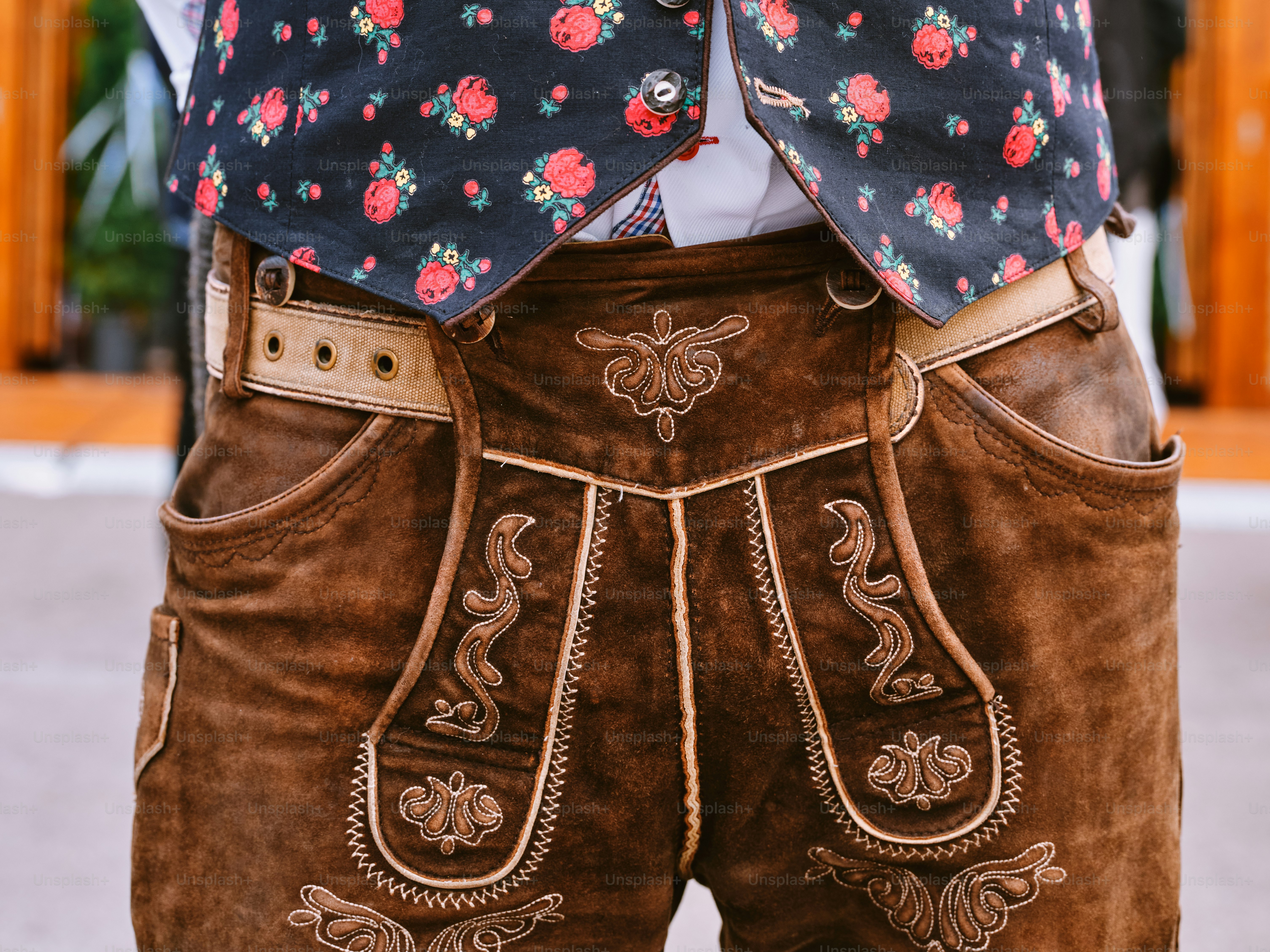 a close up of a person wearing brown pants