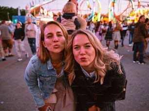 a couple of women standing next to each other