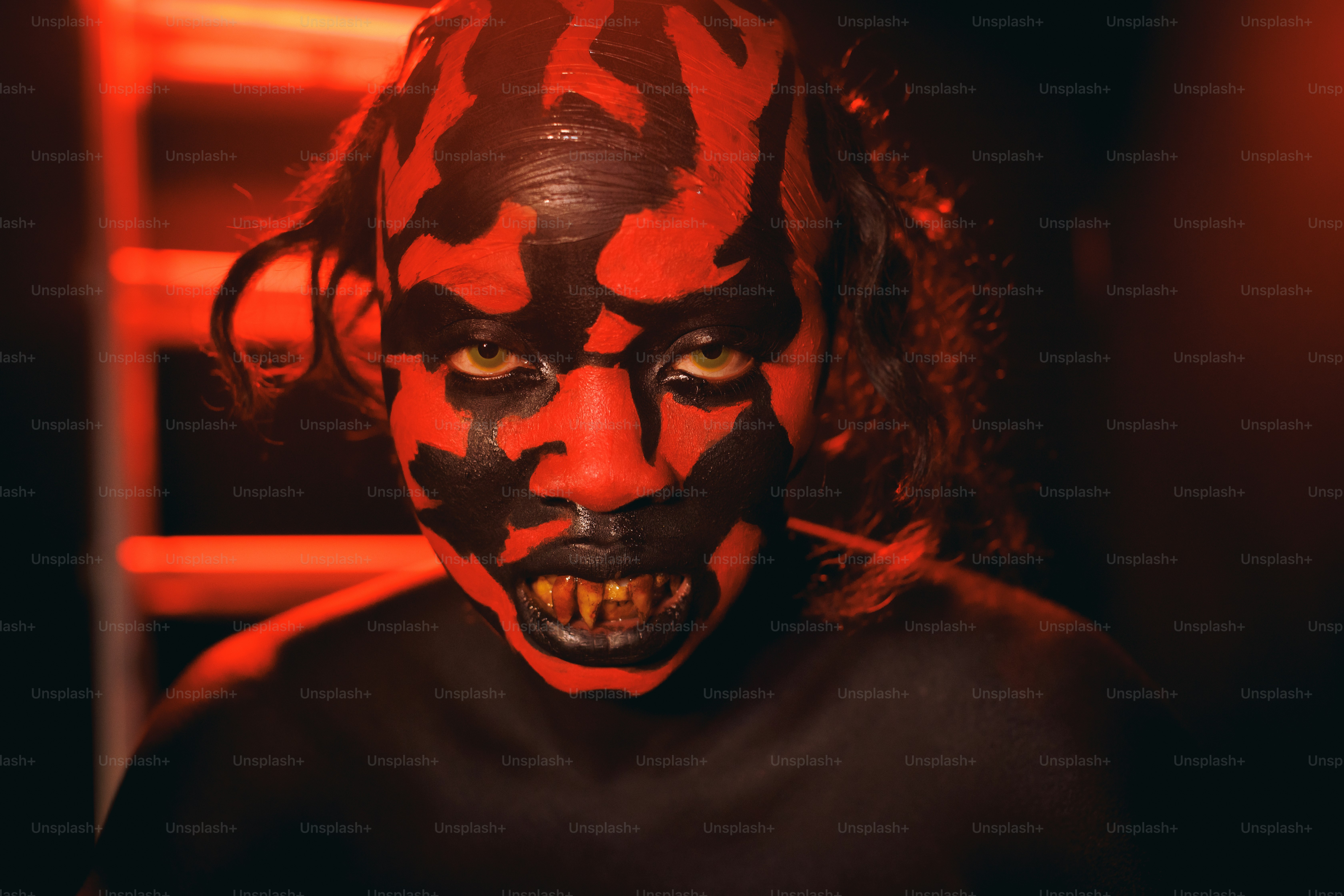 a man with a painted face and red hair