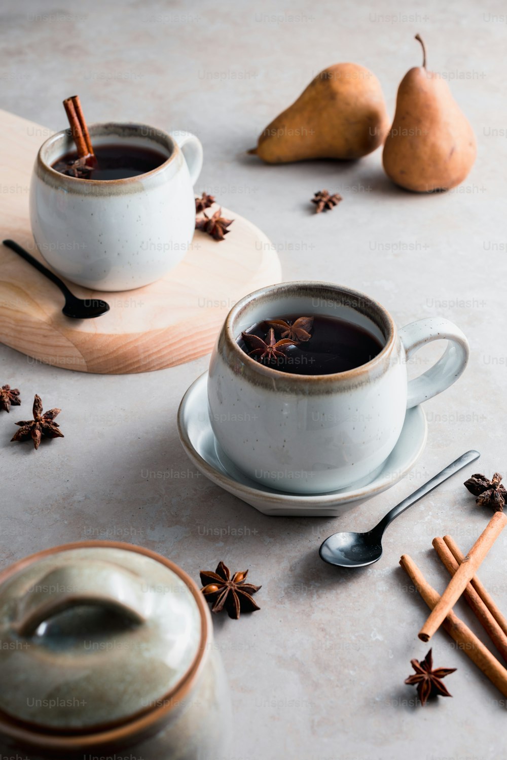 a couple of cups of coffee sitting on top of a table