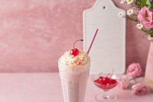 a drink with whipped cream and a cherry on top