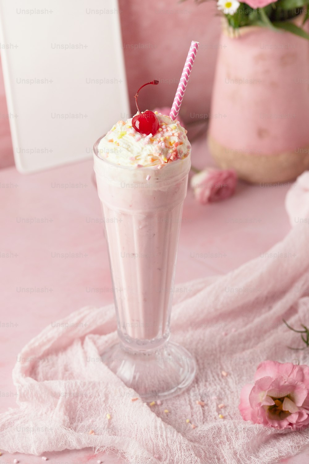 a drink with whipped cream and a cherry on top