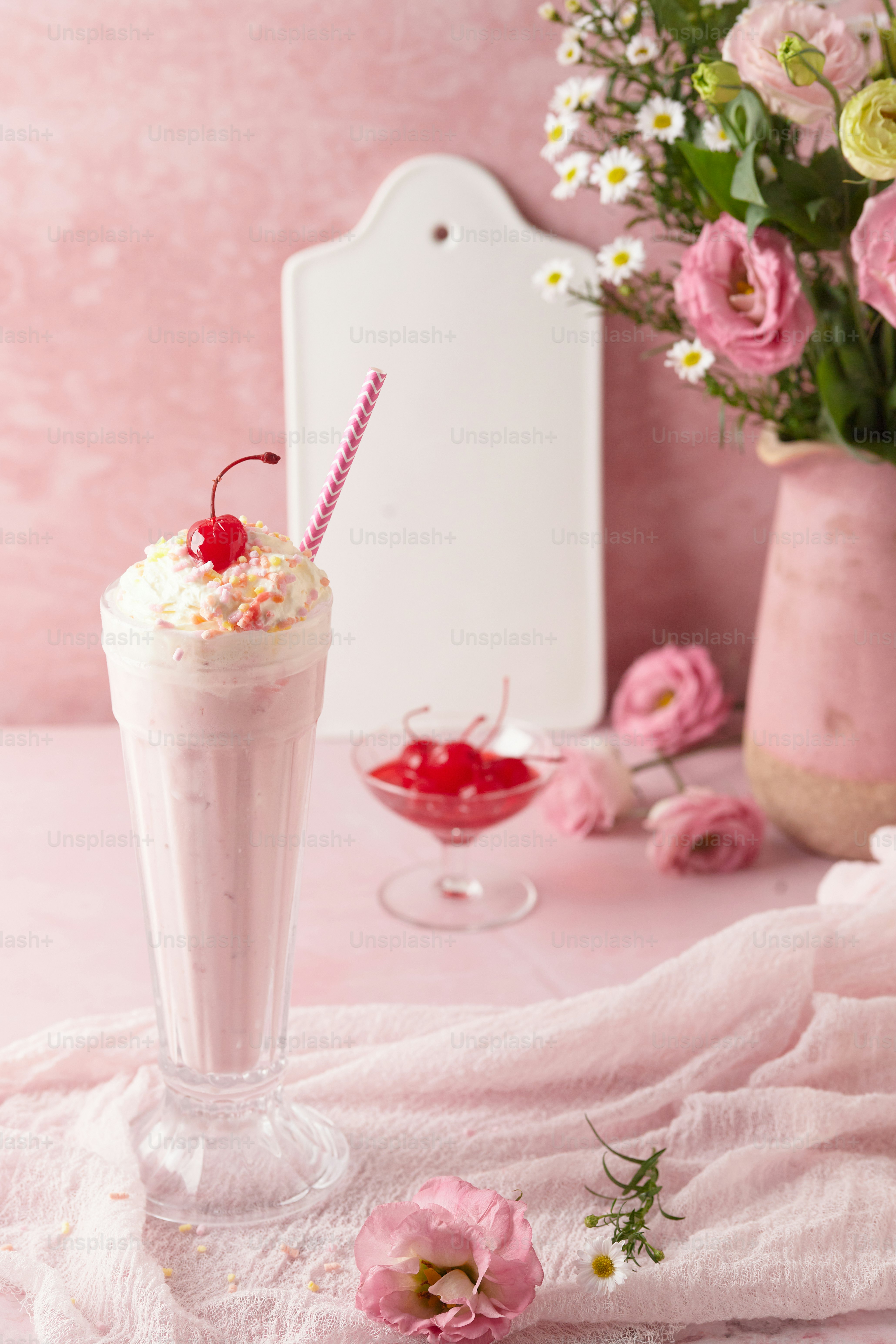 a drink with whipped cream and a cherry on top