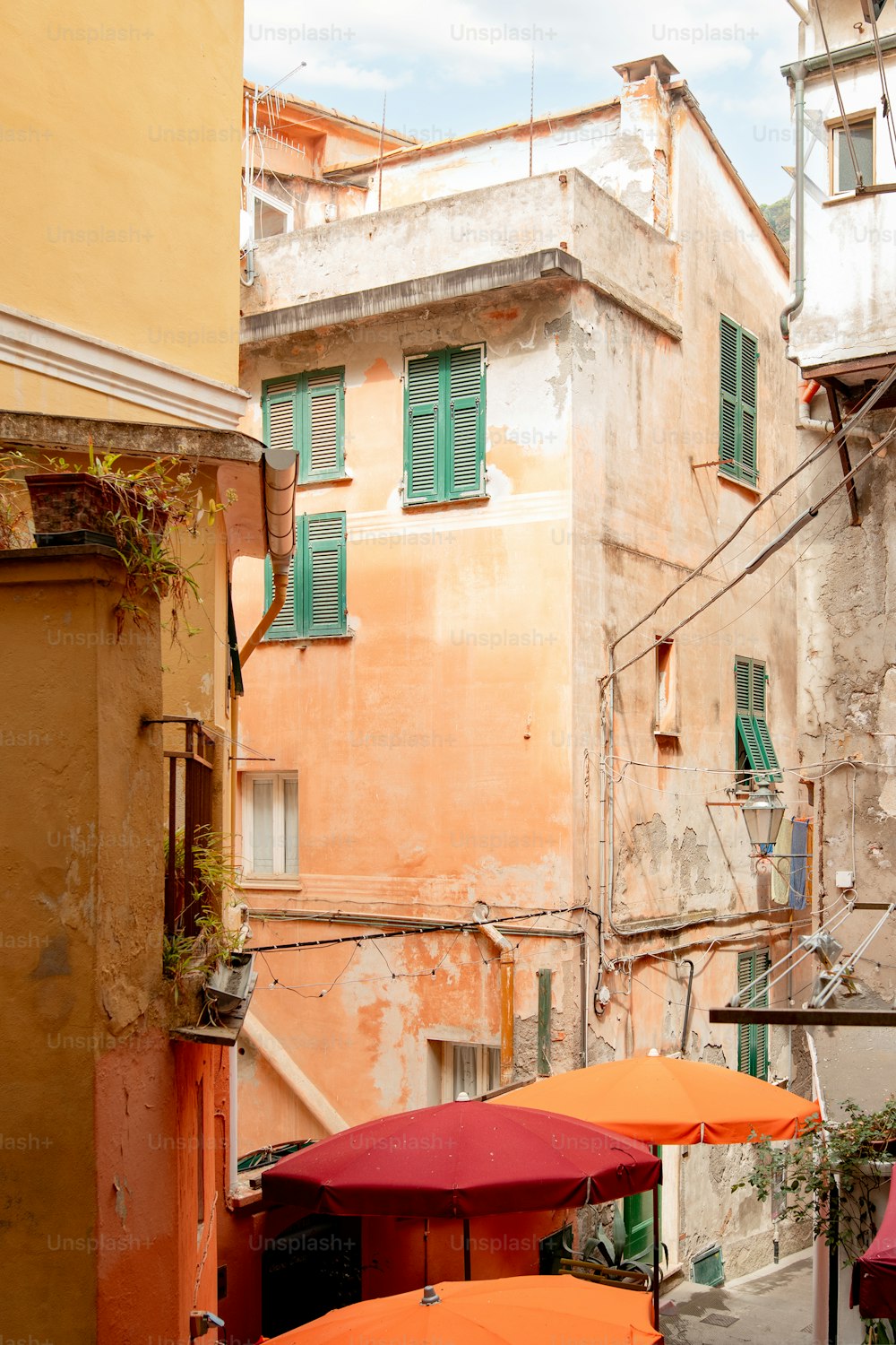 a couple of orange umbrellas sitting in front of a building