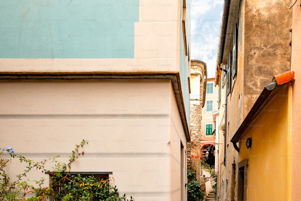 a narrow alley way with a clock on the wall