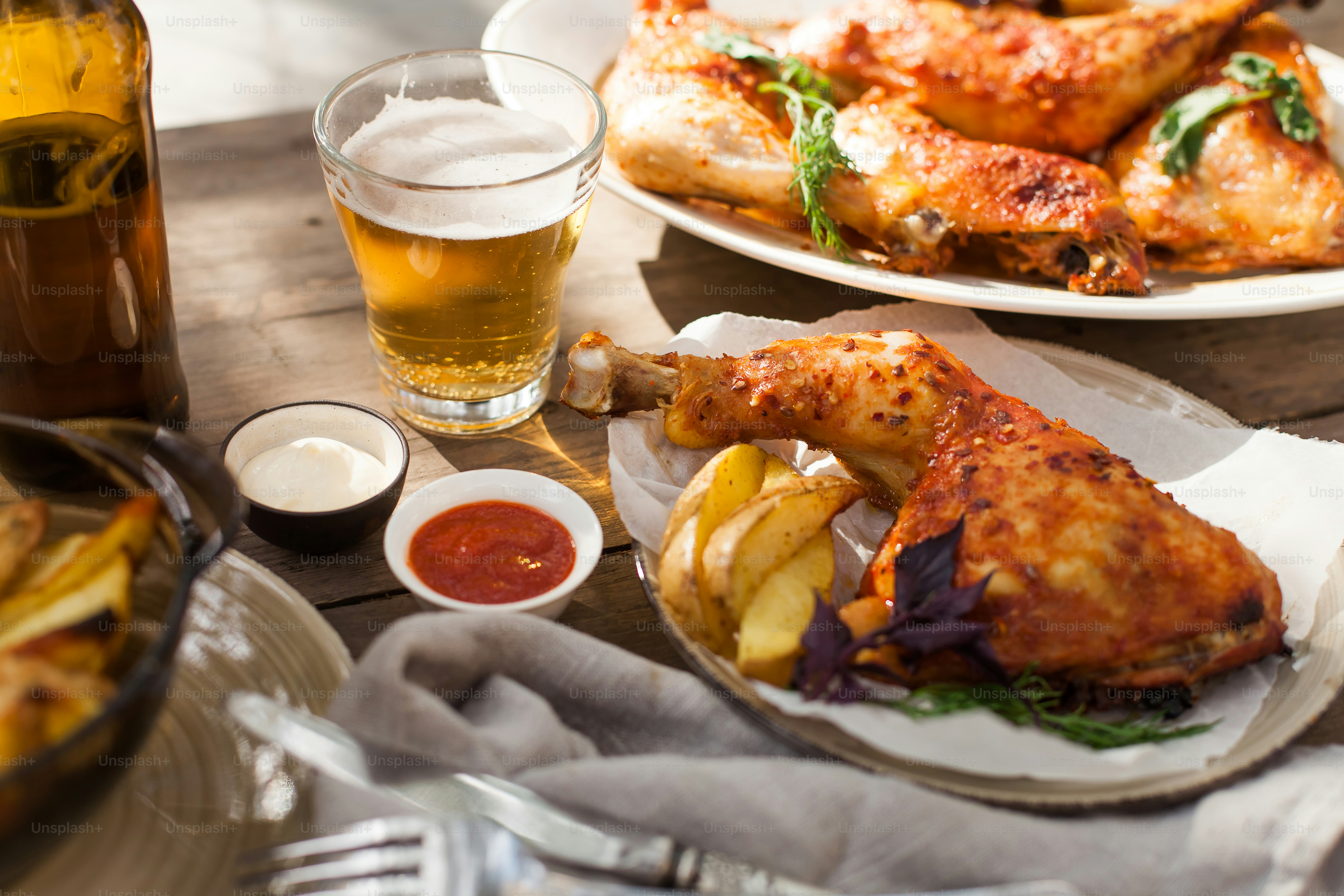 a table topped with plates of food and drinks