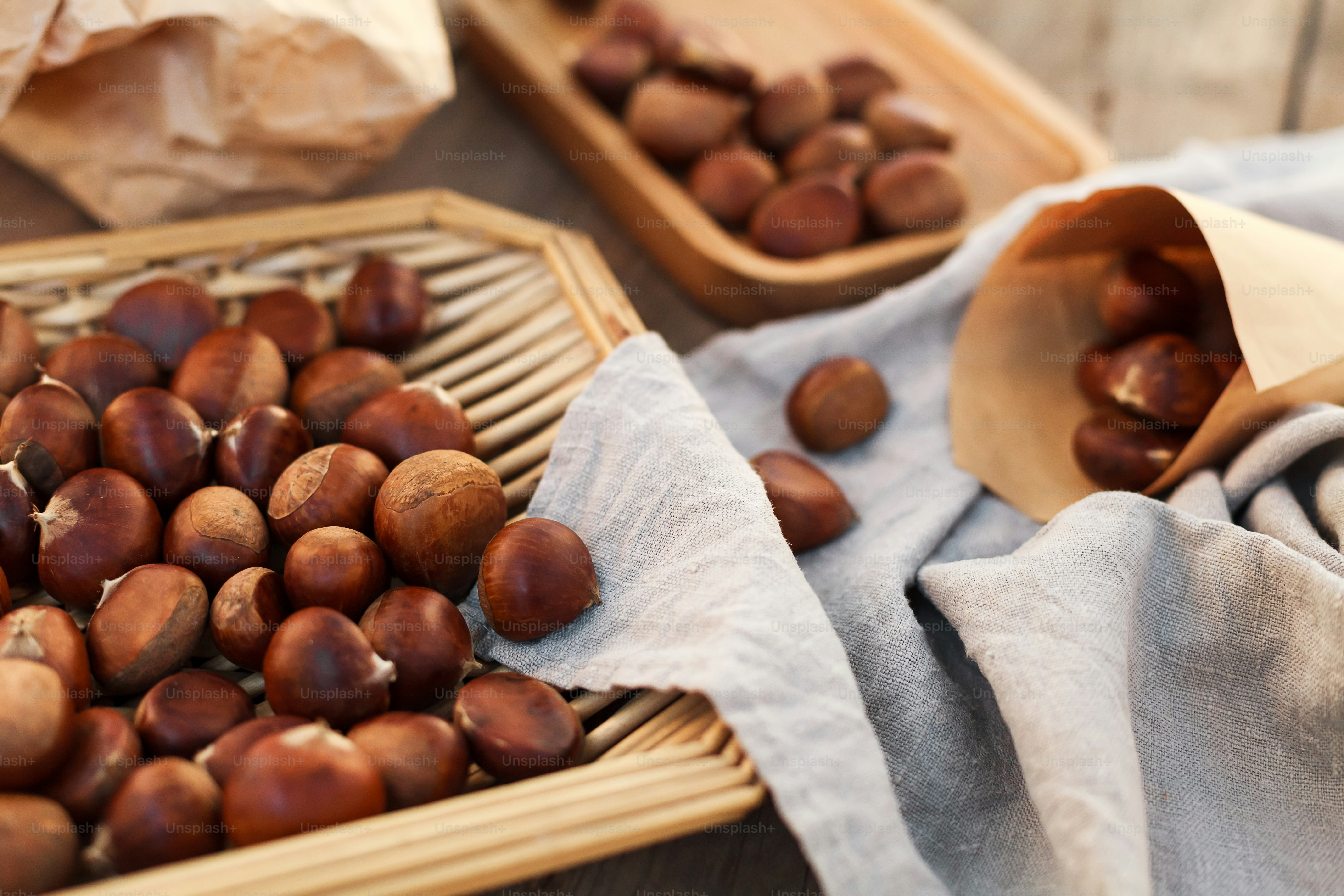 a basket filled with nuts on top of a wooden table