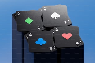 a stack of four playing cards with hearts and spades