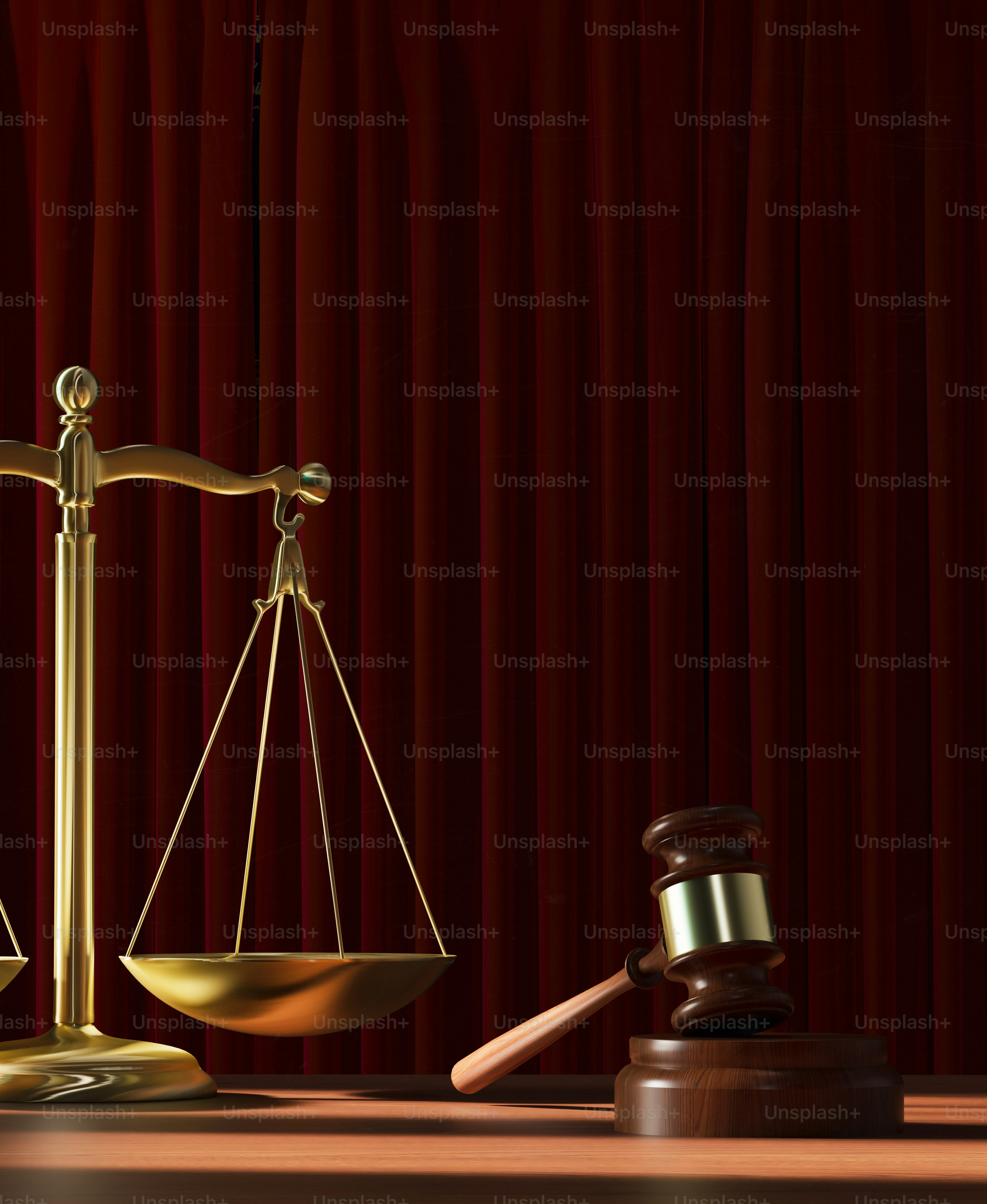 a scale and a judge's gaven on a table