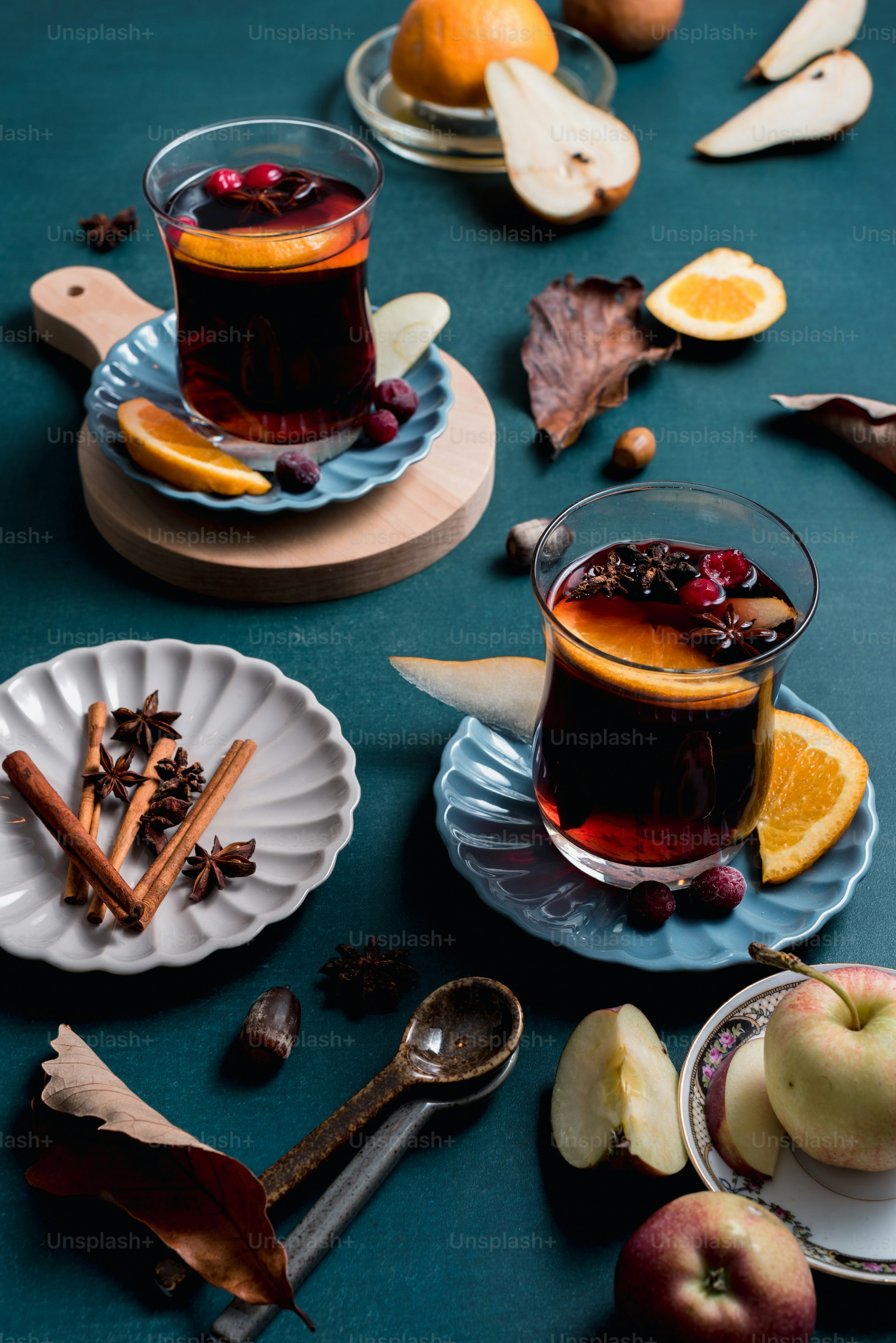 a table topped with plates of food and cups of tea