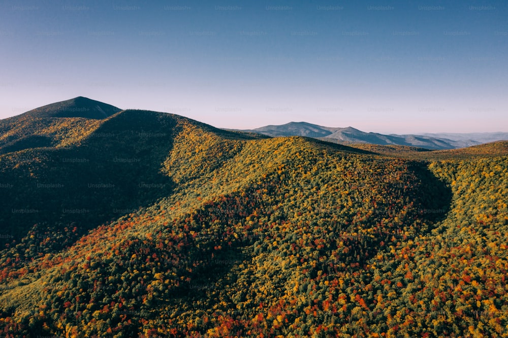 a view of a mountain range in the fall