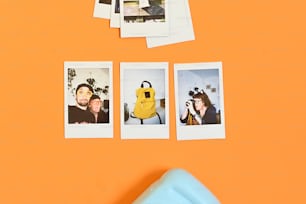 a group of polaroid pictures hanging on a wall