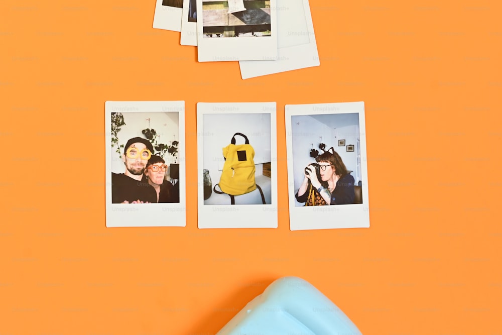 a group of polaroid pictures hanging on a wall