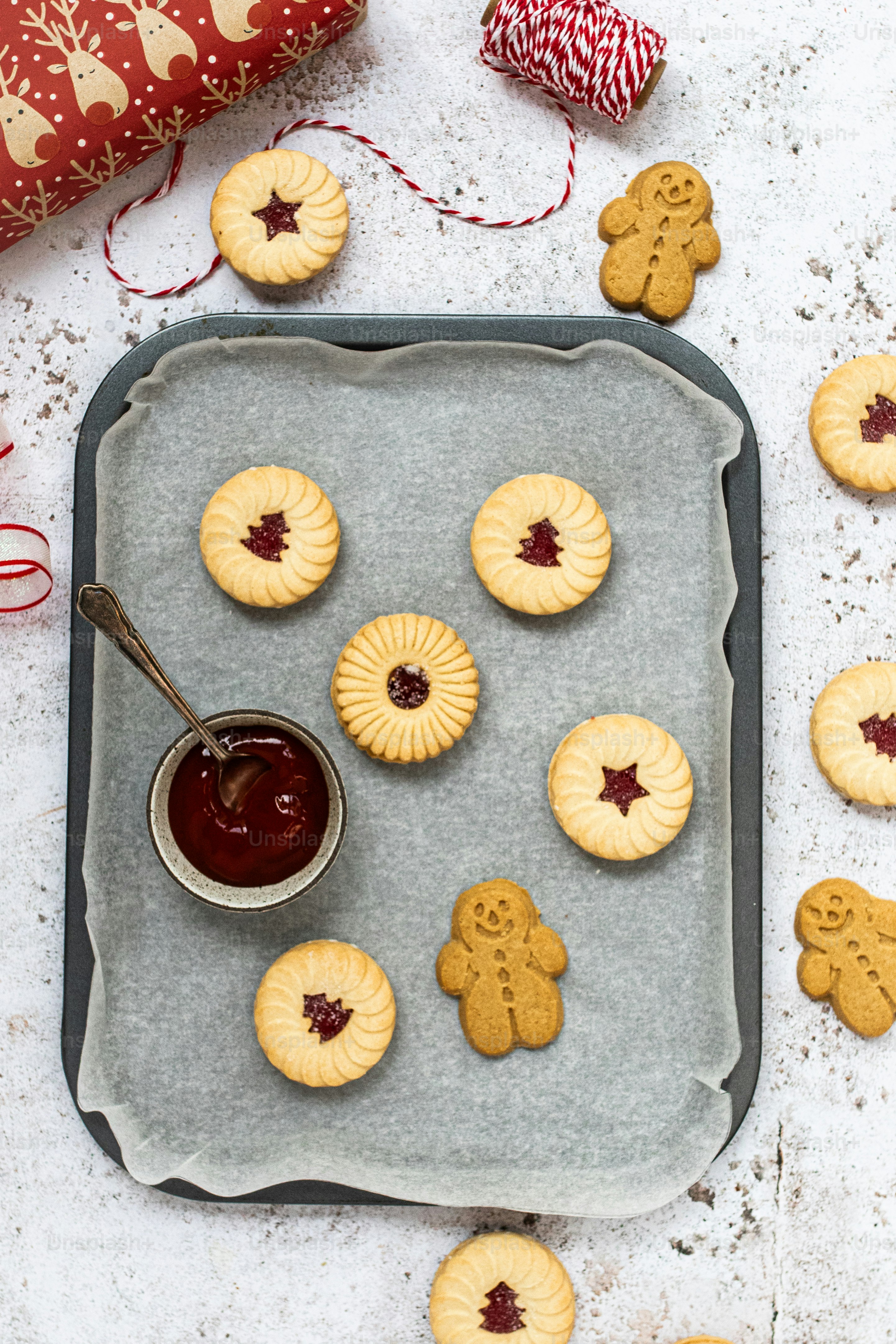 a cookie tray with cookies and jam on it