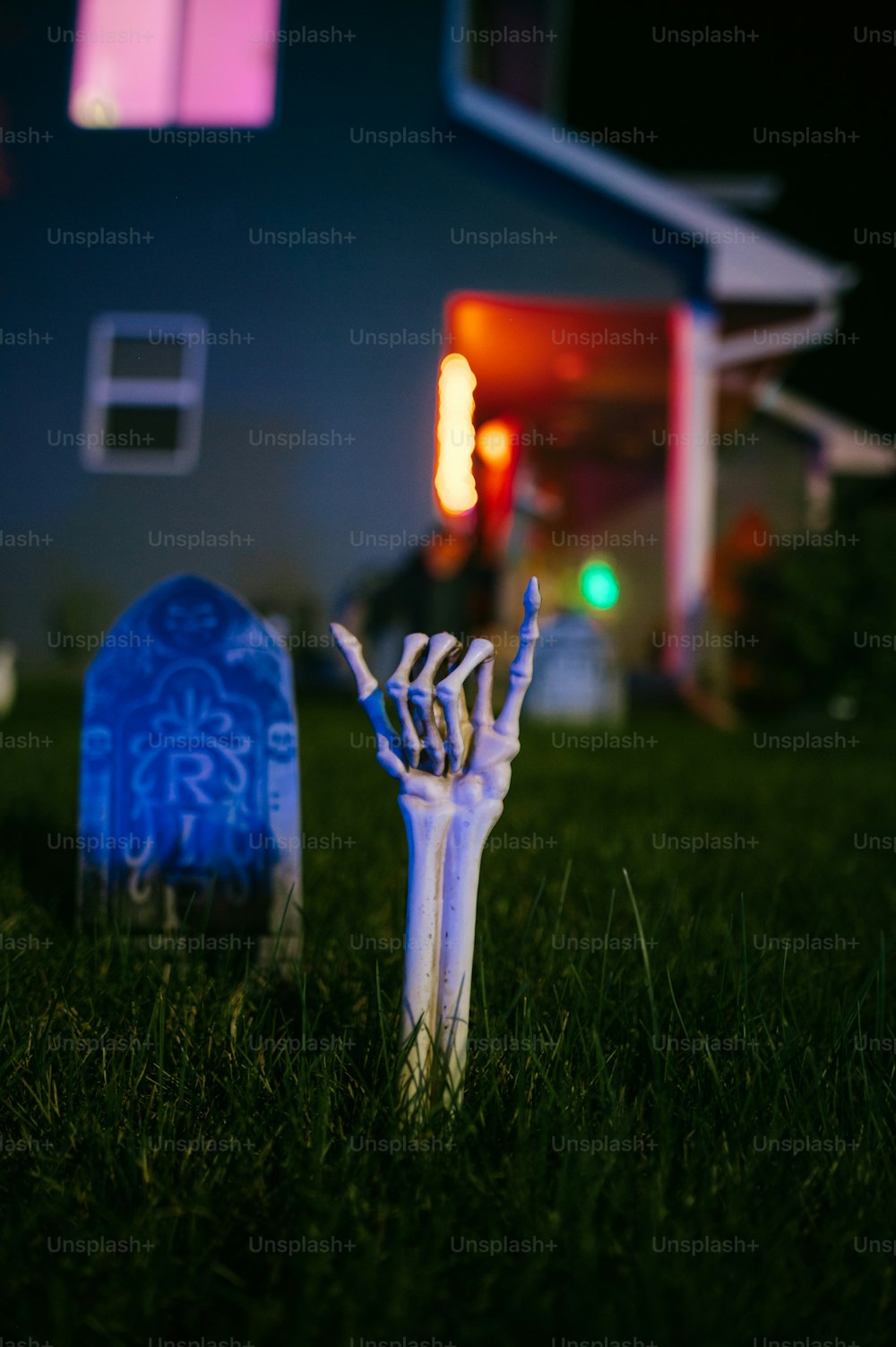 a pair of white gloves sitting on top of a lush green field