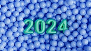 a bunch of blue balls with a green number in the middle