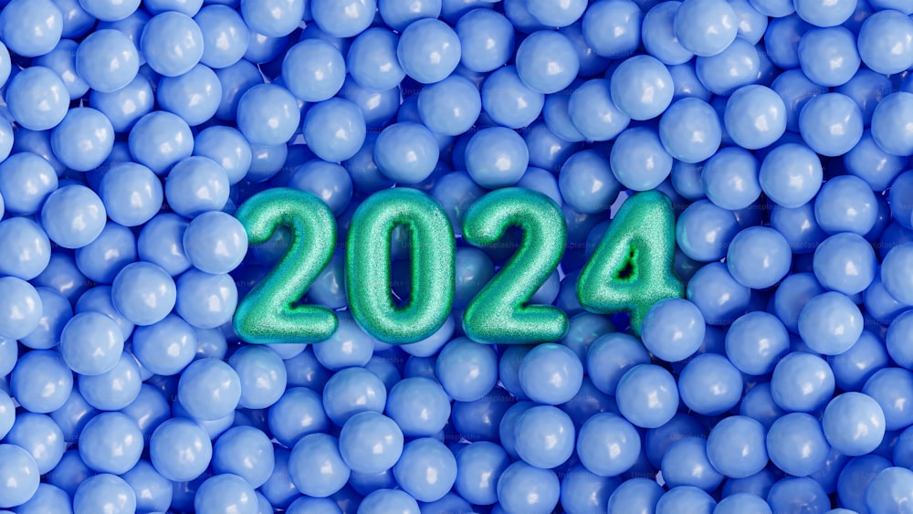 a bunch of blue balls with a green number in the middle