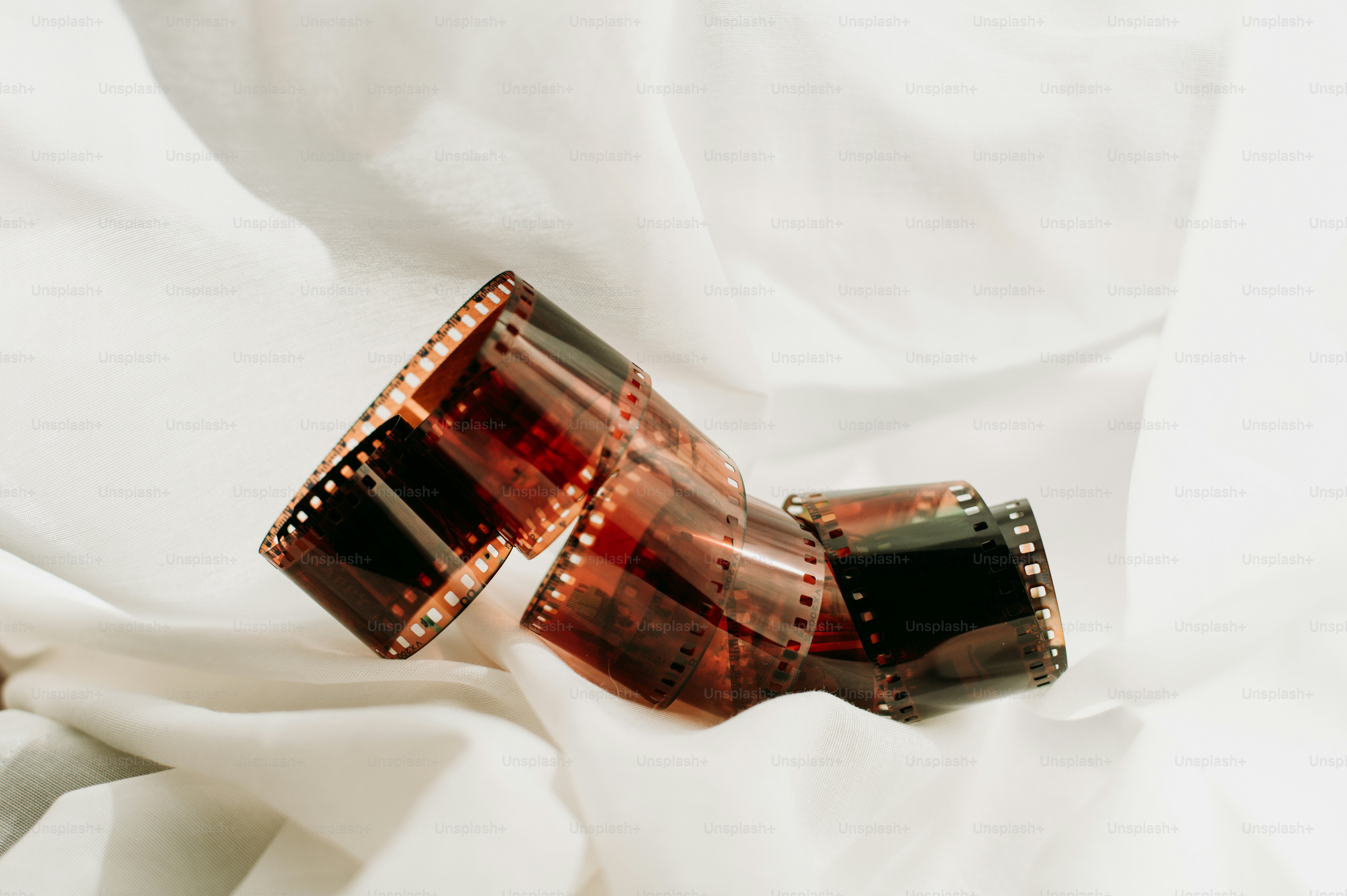 a pair of glasses sitting on top of a white sheet