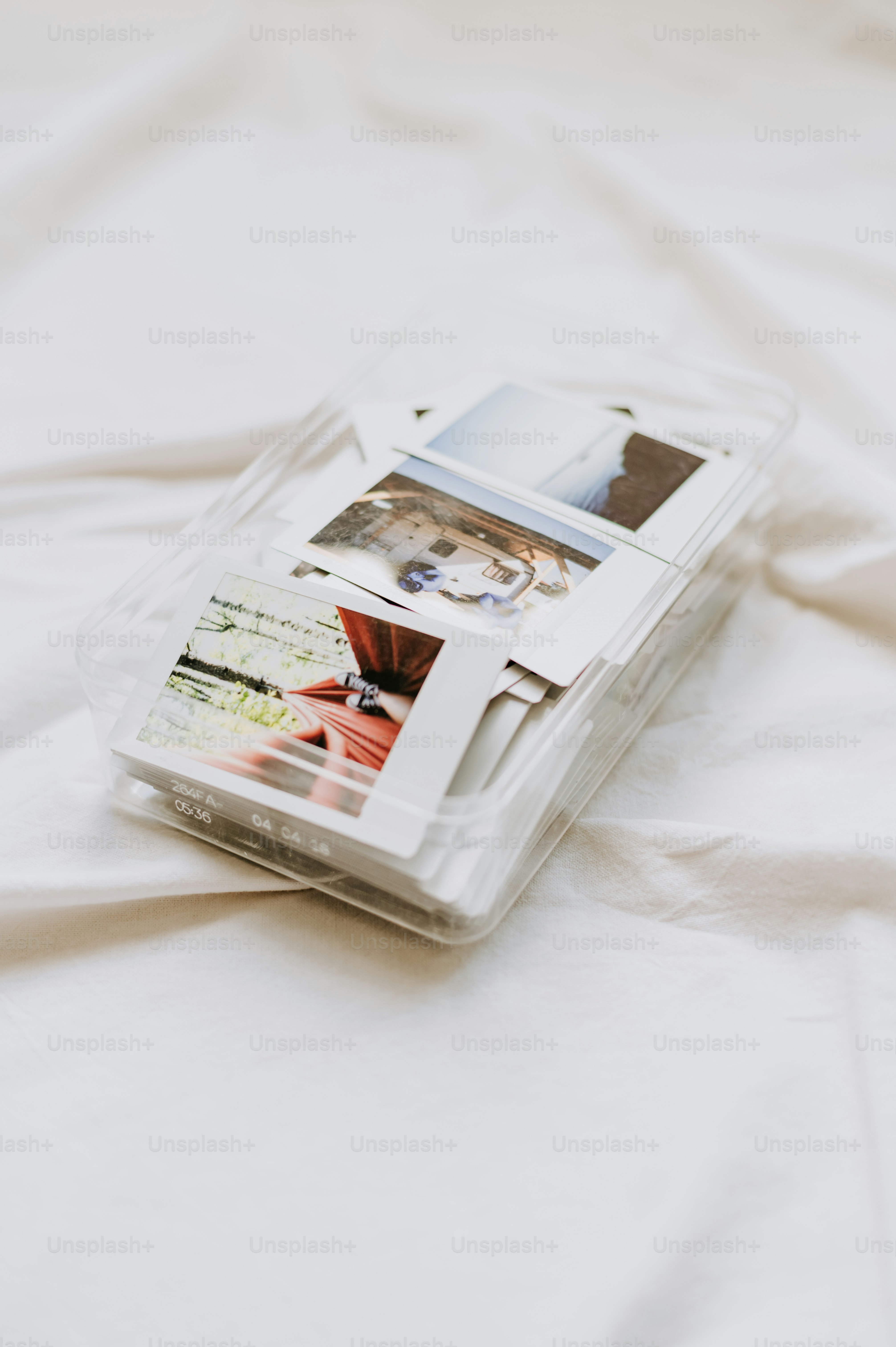 a cell phone sitting on top of a white sheet